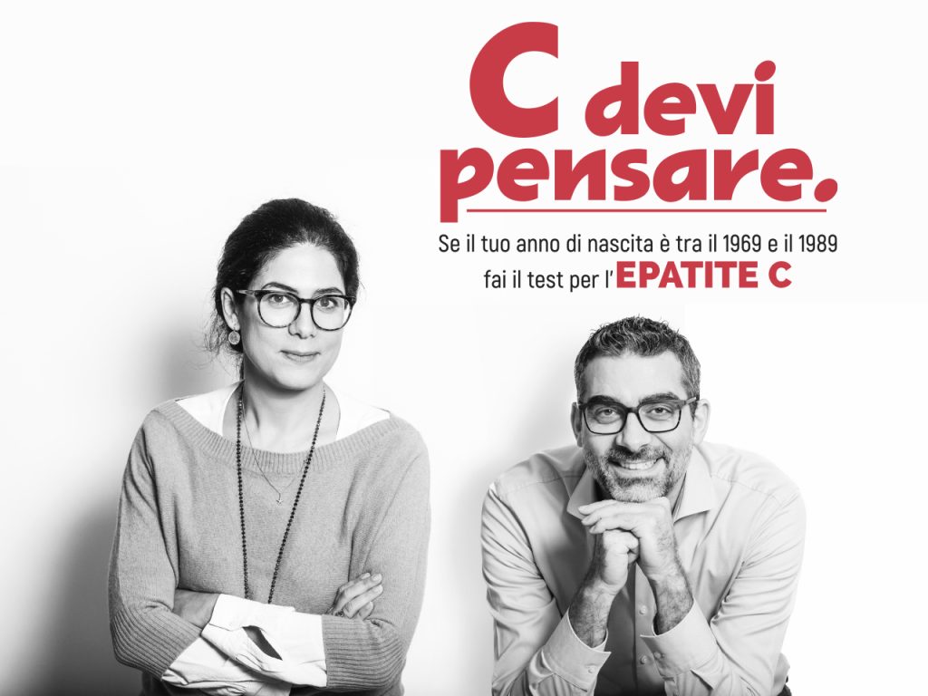 Two people with glasses, one sitting and the other leaning forward, with a text in Italian about hepatitis C awareness above them.
